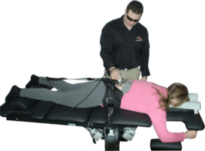 spinal decompression therapy with attendant